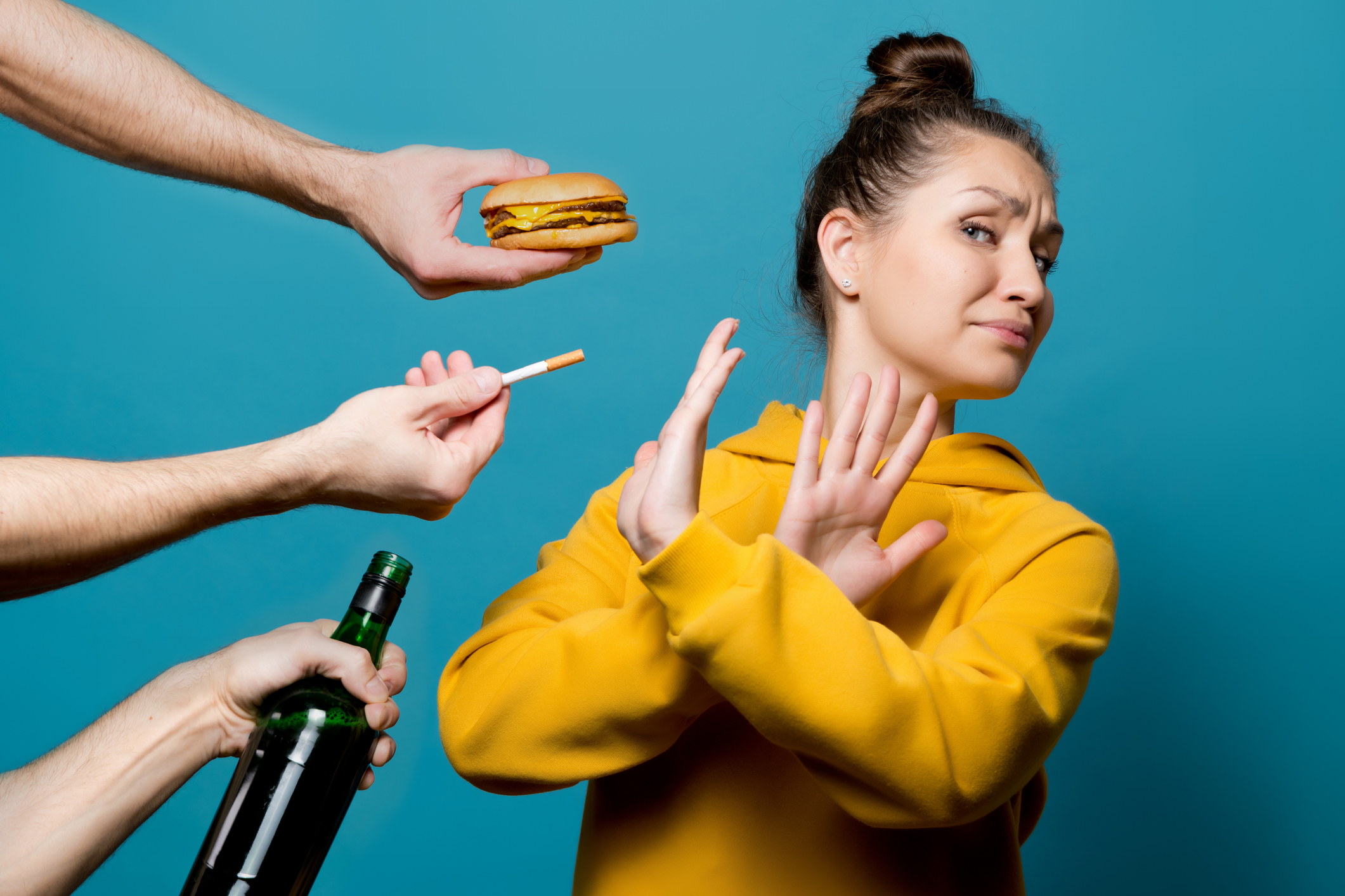 girl in bright clothes refuses junk food, alcohol and cigarettes girl in bright clothes refuses junk food, alcohol and cigarettes, preferring a healthy lifestyle